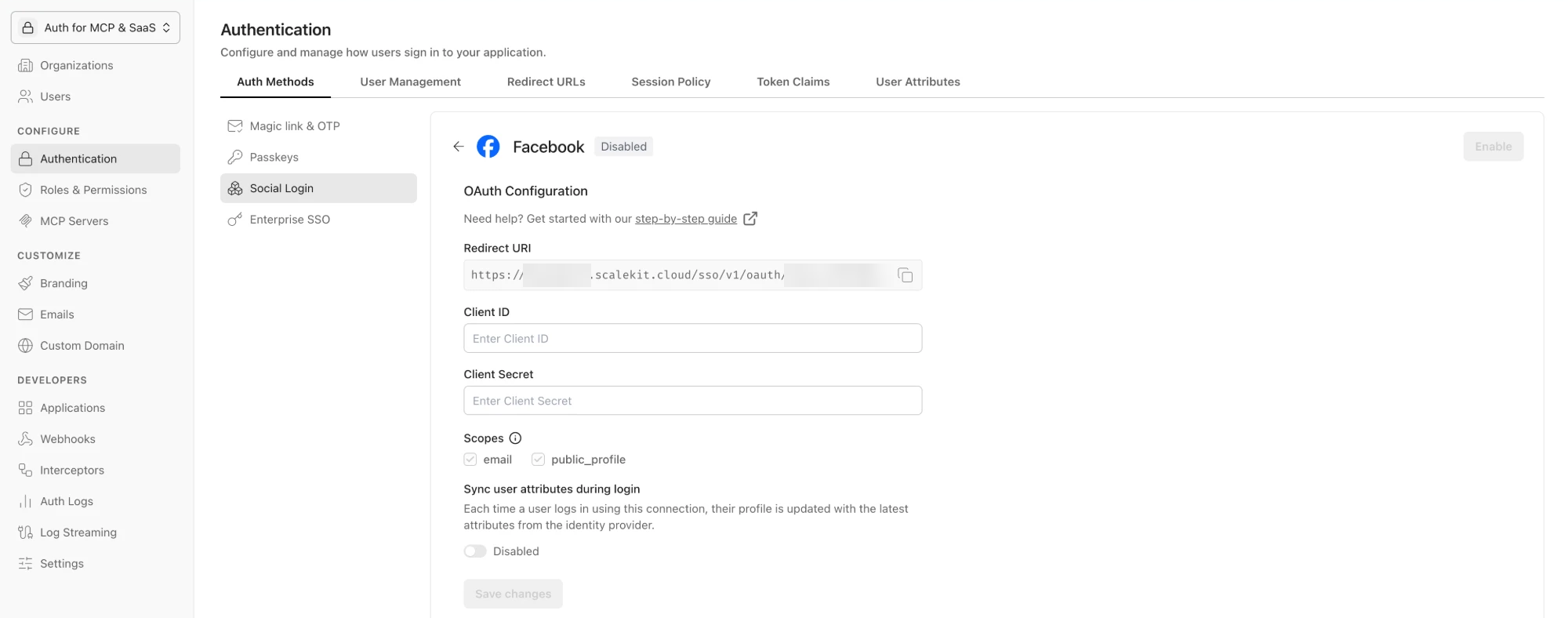 Facebook OAuth Configuration page in Scalekit, showing the Redirect URI, empty Client ID and Client Secret fields, and the email and public_profile scopes.