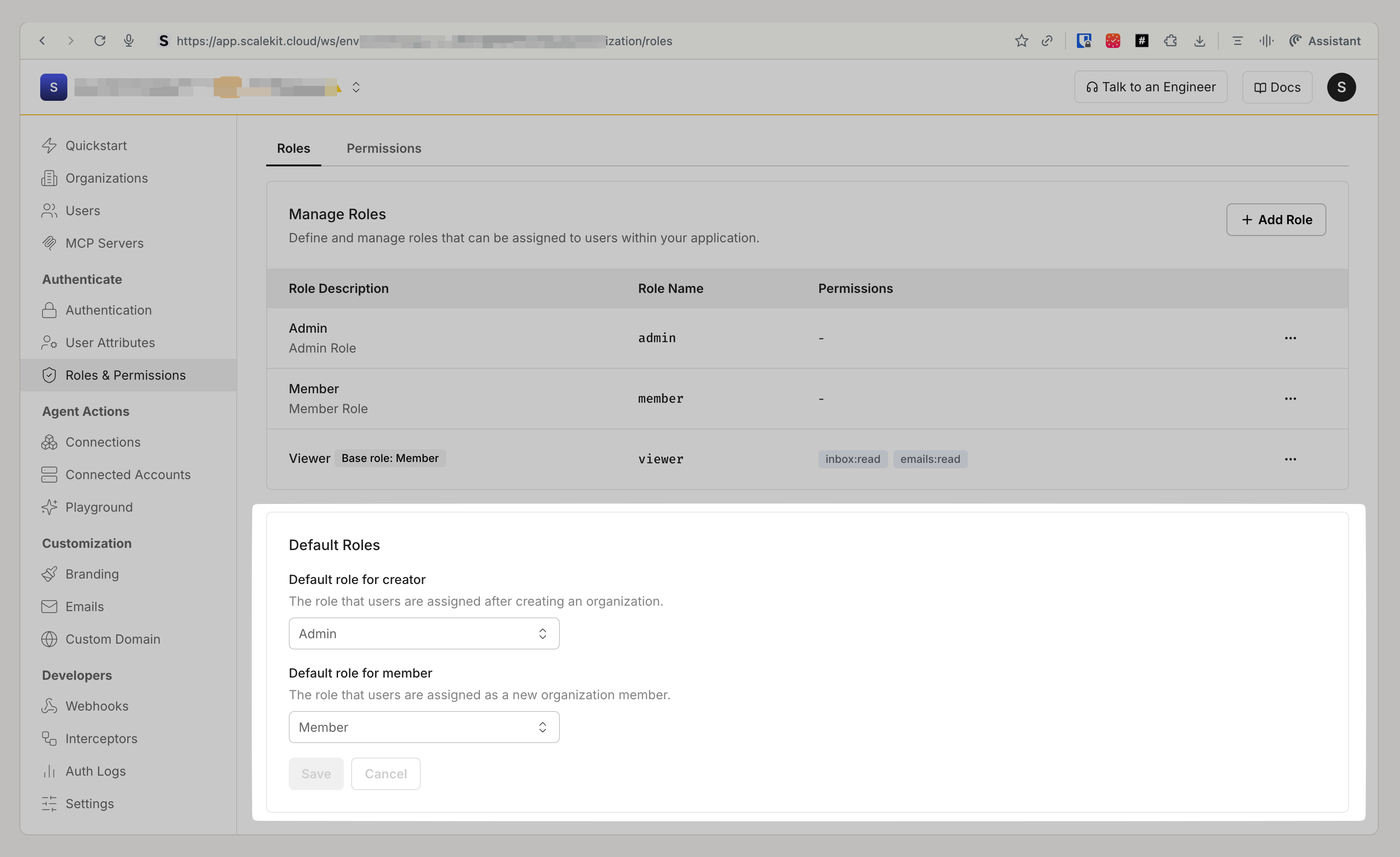 Roles & Permissions page listing admin, member, and viewer roles, with a Default Roles panel for choosing the creator and member roles